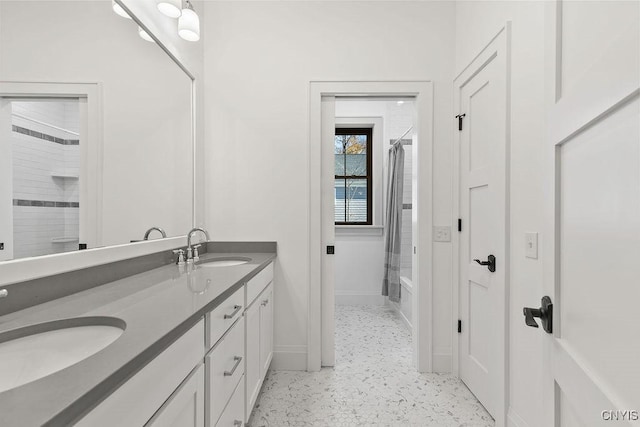 149 E Genesee St, Skaneateles, NY 13152 - full bathroom featuring double vanity, bathing tub / shower combination, and baseboards