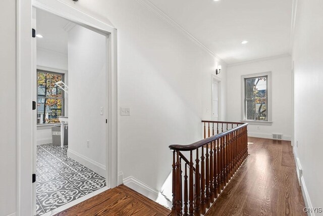 149 E Genesee St, Skaneateles, NY 13152 - corridor with an upstairs landing, crown molding, baseboards, wood finished floors, and recessed lighting
