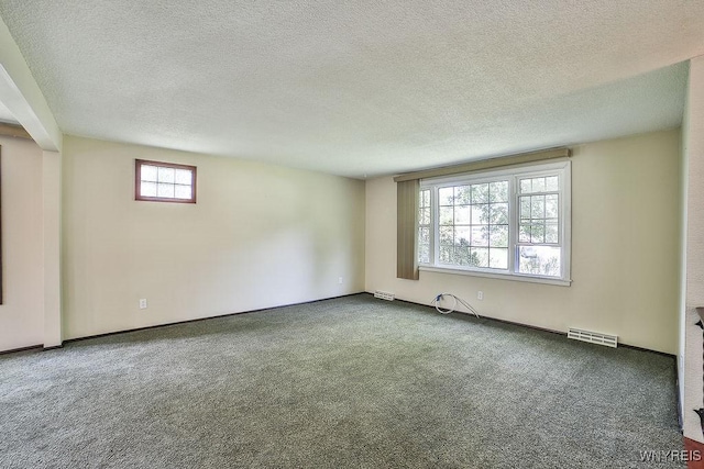 831 W Gebhard Ln, Alden, NY 14004 - empty room with carpet flooring, a textured ceiling, and baseboards