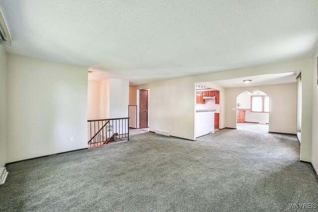 831 W Gebhard Ln, Alden, NY 14004 - carpeted empty room featuring a textured ceiling and baseboards