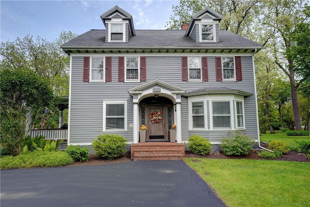 2550 E Ave, Brighton, NY 14610 - view of front facade with a front lawn