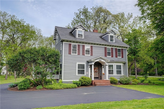 2550 E Ave, Brighton, NY 14610 - view of front of home with a front lawn and a chimney