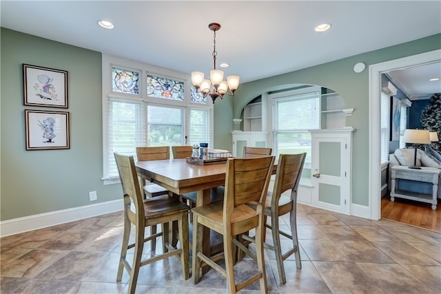 2550 E Ave, Brighton, NY 14610 - dining space with a chandelier, recessed lighting, and arched walkways