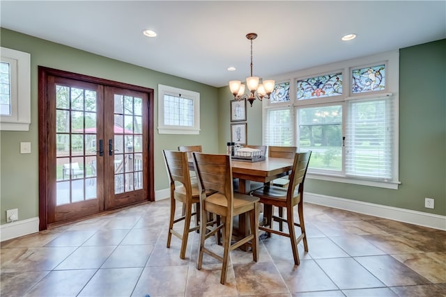 2550 E Ave, Brighton, NY 14610 - dining space with healthy amount of natural light, a chandelier, french doors, recessed lighting, and light tile patterned floors
