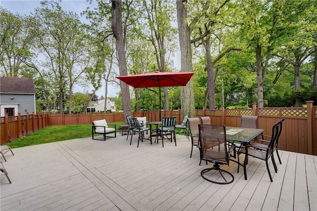 2550 E Ave, Brighton, NY 14610 - wooden deck with outdoor dining area and a fenced backyard