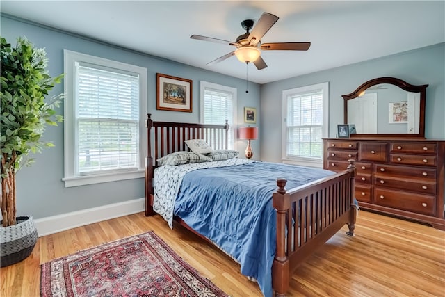 2550 E Ave, Brighton, NY 14610 - bedroom with light wood finished floors and ceiling fan