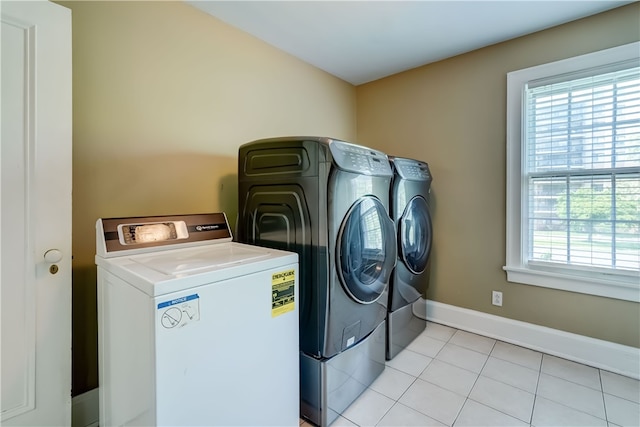 2550 E Ave, Brighton, NY 14610 - laundry area featuring washer and clothes dryer and light tile patterned floors