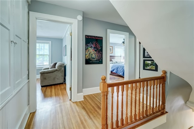 2550 E Ave, Brighton, NY 14610 - hallway with light wood finished floors and an upstairs landing