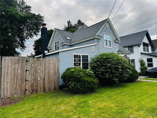 35 N 4th Ave, German Flatts, NY 13357 - view of side of property with a chimney and a shingled roof