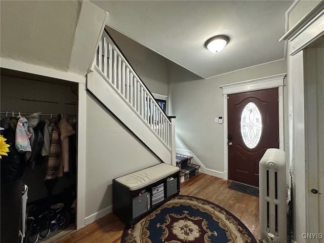 35 N 4th Ave, German Flatts, NY 13357 - foyer with radiator, wood finished floors, and stairs