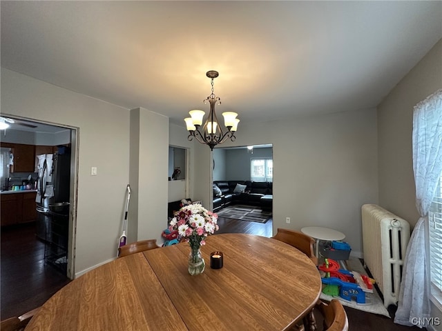 35 N 4th Ave, German Flatts, NY 13357 - dining space with radiator, a chandelier, and dark wood-type flooring