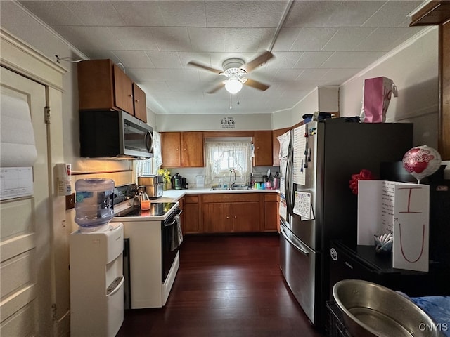 35 N 4th Ave, German Flatts, NY 13357 - kitchen featuring appliances with stainless steel finishes, brown cabinetry, a ceiling fan, light countertops, and dark wood-style flooring