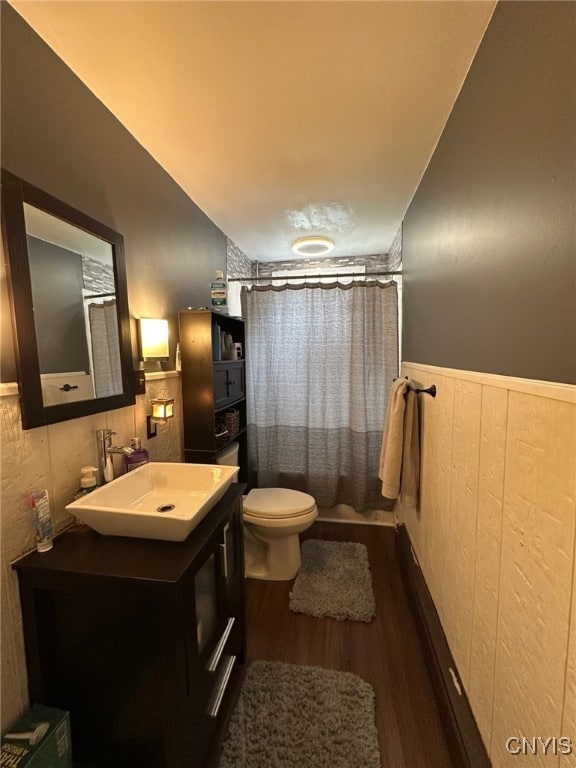 35 N 4th Ave, German Flatts, NY 13357 - bathroom featuring wood finished floors, a wainscoted wall, vanity, a shower with shower curtain, and wooden walls