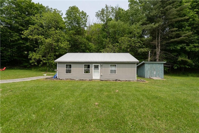 7848 Cold Springs Rd, Urbana, NY 14810 - view of front facade featuring a front lawn and metal roof