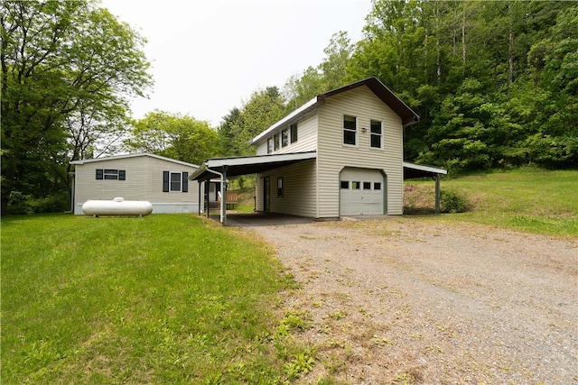 7848 Cold Springs Rd, Urbana, NY 14810 - view of front of house featuring driveway, a front lawn, and a garage