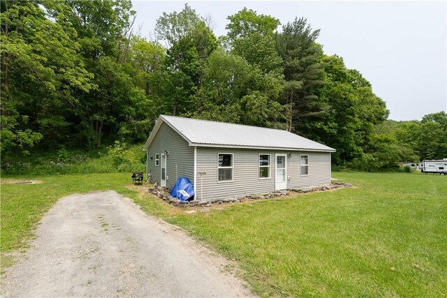7848 Cold Springs Rd, Urbana, NY 14810 - view of front of home featuring a front lawn and metal roof