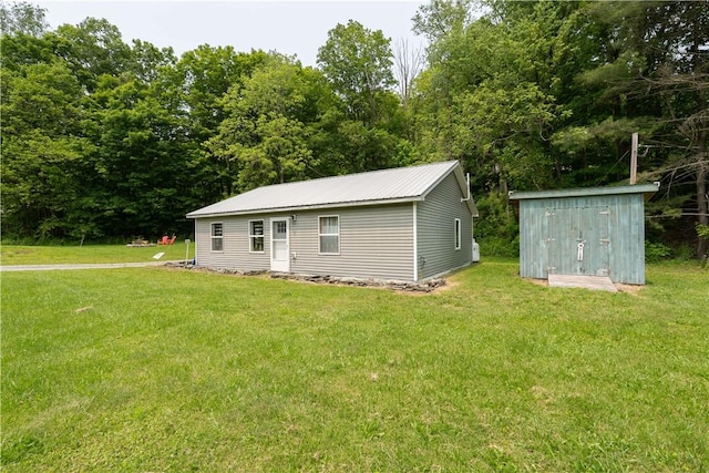 7848 Cold Springs Rd, Urbana, NY 14810 - view of front of house featuring a front lawn and metal roof