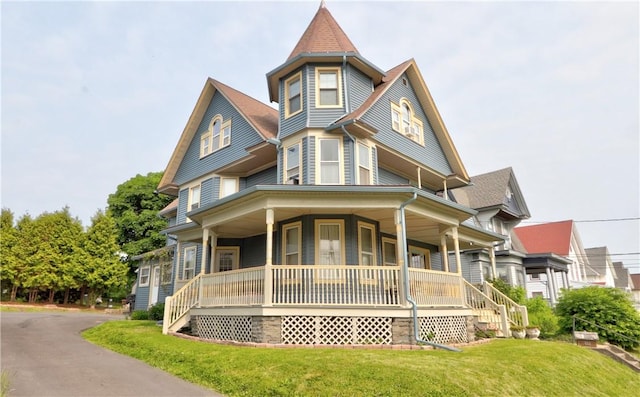 51 Sherrill St Unit 1, Geneva-City, NY 14456 - victorian-style house featuring covered porch and a front yard