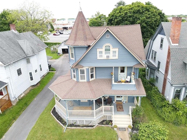 51 Sherrill St Unit 1, Geneva-City, NY 14456 - view of front facade with a shingled roof, a front lawn, and a balcony