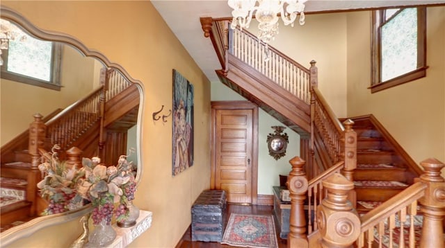51 Sherrill St Unit 1, Geneva-City, NY 14456 - stairway with a chandelier and wood finished floors