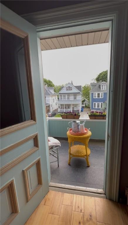 51 Sherrill St Unit 1, Geneva-City, NY 14456 - doorway to outside with wood finished floors