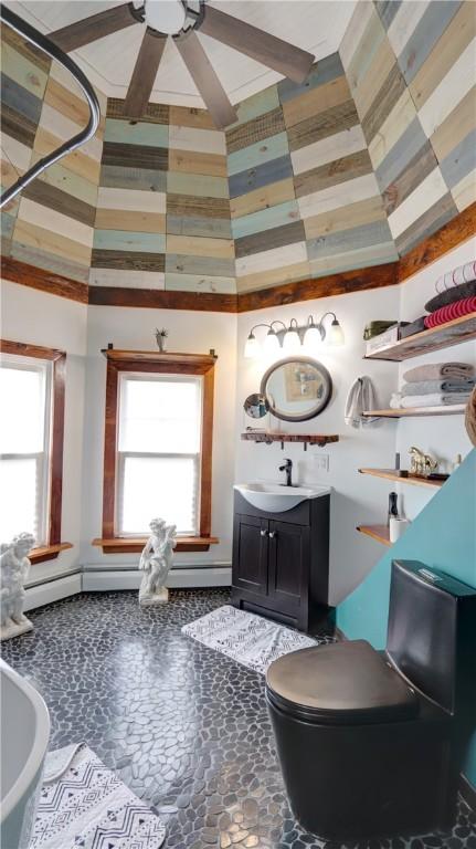 51 Sherrill St Unit 1, Geneva-City, NY 14456 - bathroom with plenty of natural light, vanity, ceiling fan, and toilet