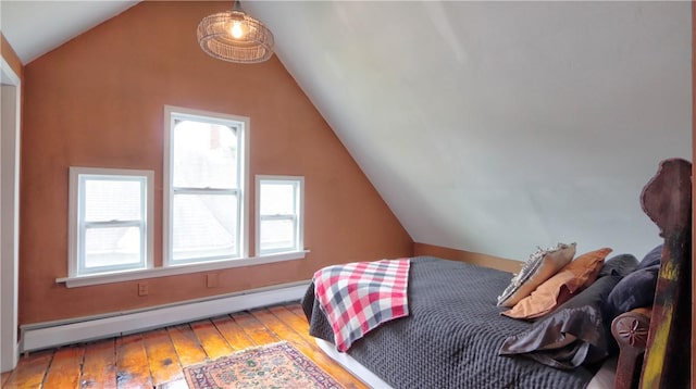 51 Sherrill St Unit 1, Geneva-City, NY 14456 - bedroom featuring baseboard heating, hardwood / wood-style flooring, and lofted ceiling