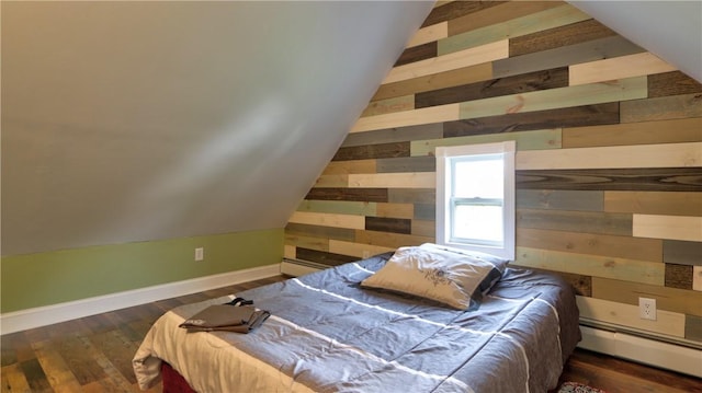 51 Sherrill St Unit 1, Geneva-City, NY 14456 - bedroom with wooden walls, baseboard heating, vaulted ceiling, wood finished floors, and baseboards