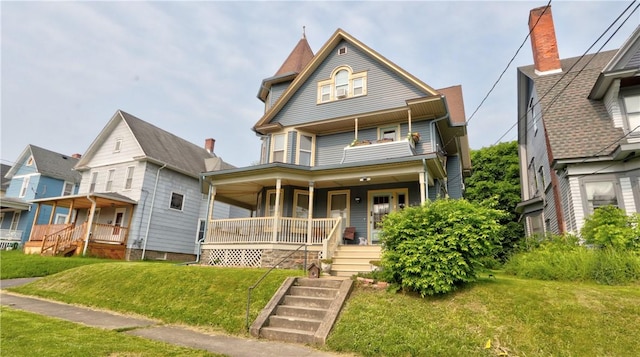 51 Sherrill St Unit 1, Geneva-City, NY 14456 - victorian home featuring a porch and a front yard