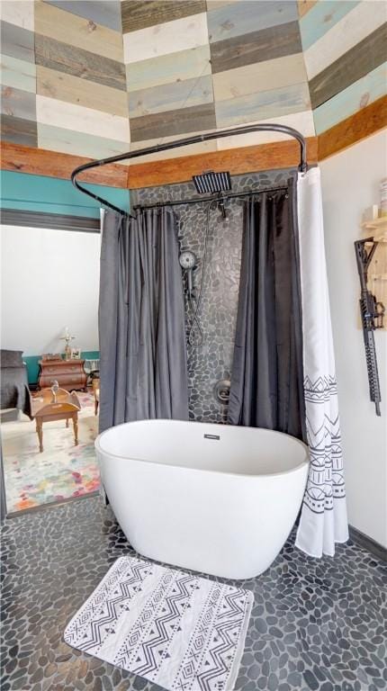 51 Sherrill St Unit 1, Geneva-City, NY 14456 - full bath with a freestanding tub and stone finish flooring