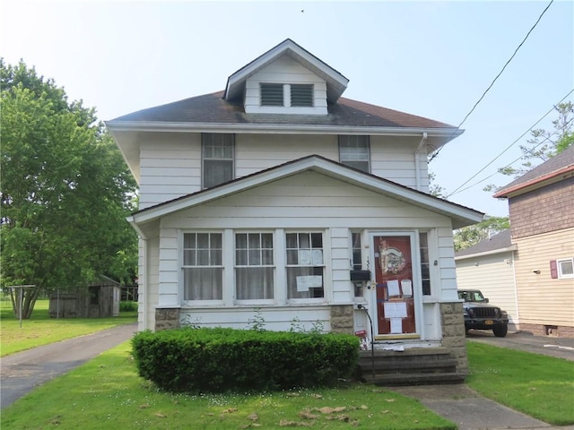 132 Chapman Ave, Auburn, NY 13021 - american foursquare style home with a front yard and roof with shingles