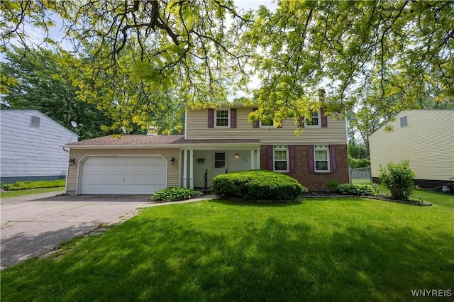 897 Fairmont Ave, North Tonawanda, NY 14120 - view of front of house with a front lawn, an attached garage, driveway, and brick siding