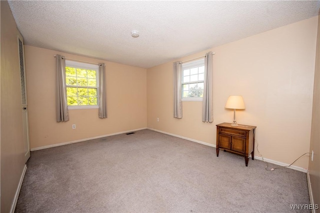 897 Fairmont Ave, North Tonawanda, NY 14120 - carpeted spare room with healthy amount of natural light and a textured ceiling