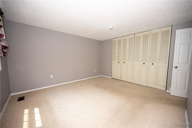897 Fairmont Ave, North Tonawanda, NY 14120 - unfurnished bedroom with carpet and a textured ceiling