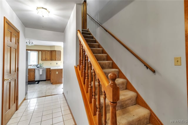 25 5th Ave, Amherst, NY 14221 - staircase featuring tile patterned flooring and baseboards