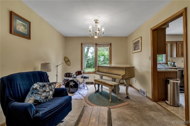 25 5th Ave, Amherst, NY 14221 - living area with a chandelier, baseboards, and light colored carpet