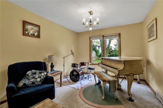 25 5th Ave, Amherst, NY 14221 - living area with carpet floors, a chandelier, and baseboards