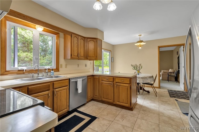 25 5th Ave, Amherst, NY 14221 - kitchen with appliances with stainless steel finishes, a sink, a peninsula, a chandelier, and brown cabinetry