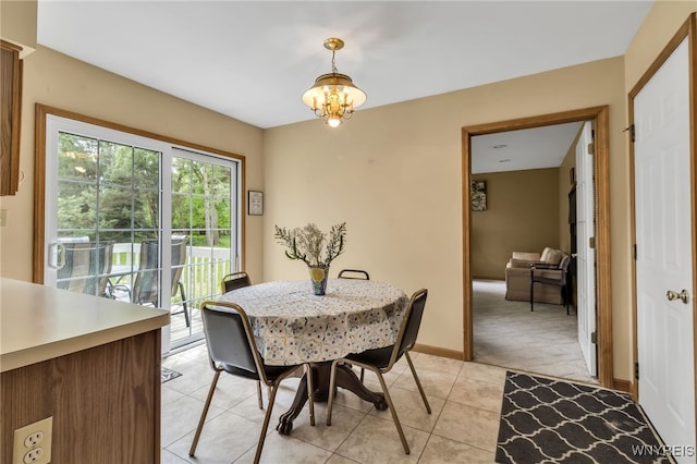 25 5th Ave, Amherst, NY 14221 - dining room featuring healthy amount of natural light, light tile patterned floors, a chandelier, and baseboards