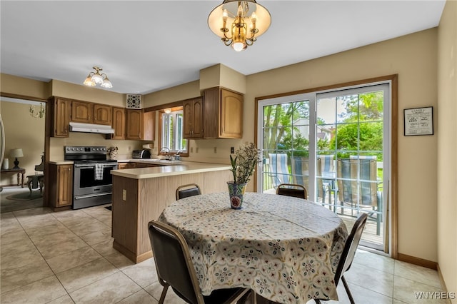 25 5th Ave, Amherst, NY 14221 - dining room featuring light tile patterned flooring, a chandelier, and baseboards