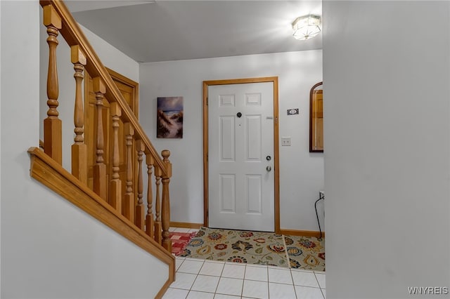 25 5th Ave, Amherst, NY 14221 - foyer with stairway, light tile patterned floors, and baseboards