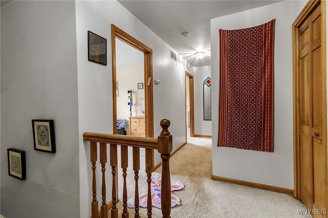 25 5th Ave, Amherst, NY 14221 - corridor with light carpet, an upstairs landing, and baseboards