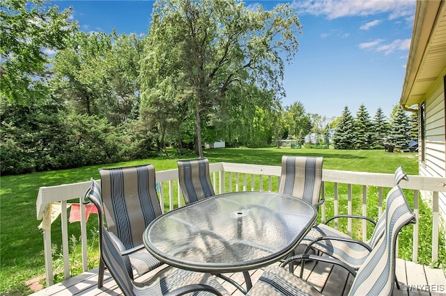 25 5th Ave, Amherst, NY 14221 - deck featuring outdoor dining area, a yard, and view of wooded area