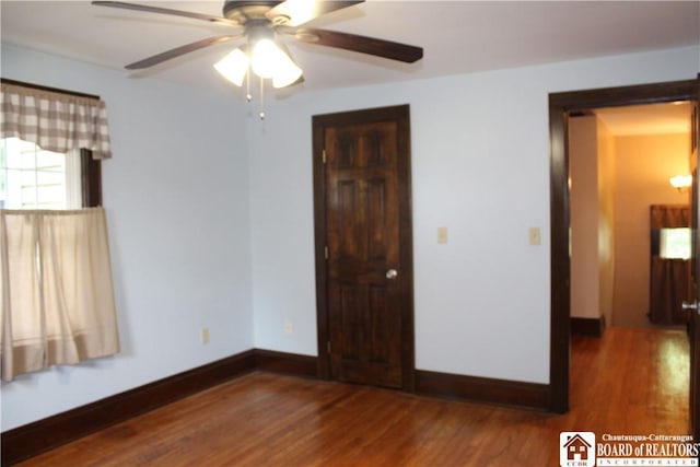 3582 Rte 20, Sheridan, NY 14063 - unfurnished bedroom featuring wood finished floors, baseboards, and a ceiling fan