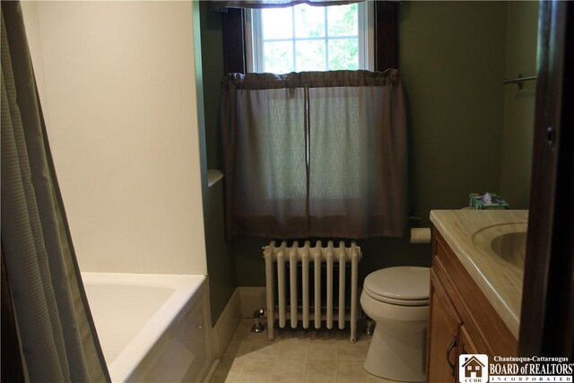 3582 Rte 20, Sheridan, NY 14063 - full bathroom featuring radiator heating unit, toilet, vanity, a tub, and tile patterned flooring