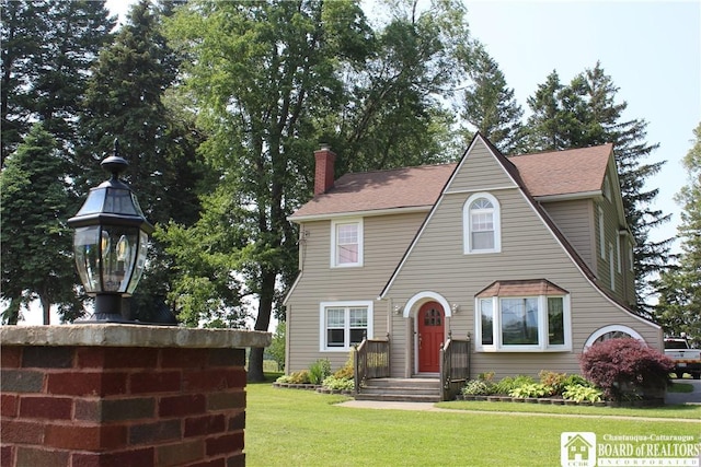 3582 Rte 20, Sheridan, NY 14063 - view of front of home with a front yard, a chimney, and roof with shingles
