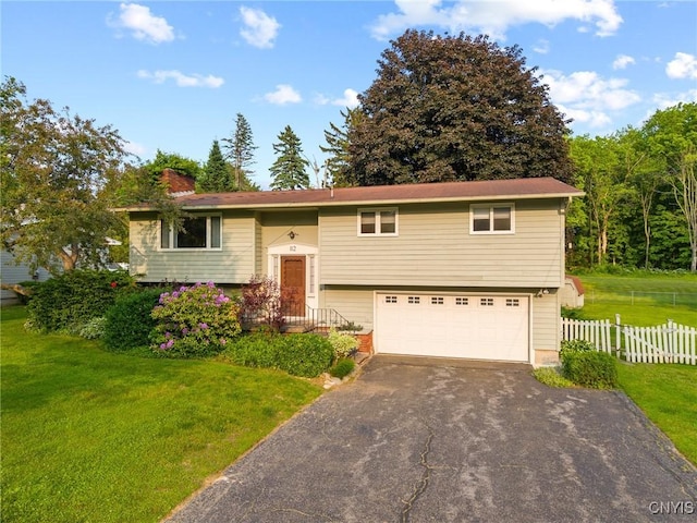 112 Elmcrest Cir, Salina, NY 13090 - bi-level home with driveway, a garage, and a chimney