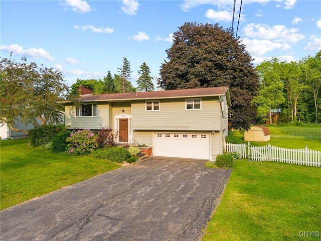 112 Elmcrest Cir, Salina, NY 13090 - split foyer home with driveway, an attached garage, and a chimney