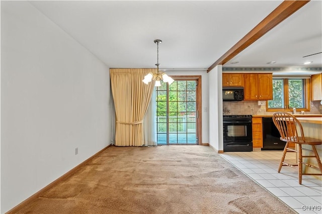 112 Elmcrest Cir, Salina, NY 13090 - kitchen featuring black appliances, a chandelier, healthy amount of natural light, and backsplash