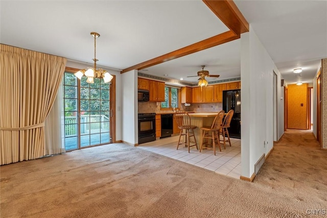 112 Elmcrest Cir, Salina, NY 13090 - dining room featuring light carpet, a chandelier, baseboards, light tile patterned floors, and a ceiling fan